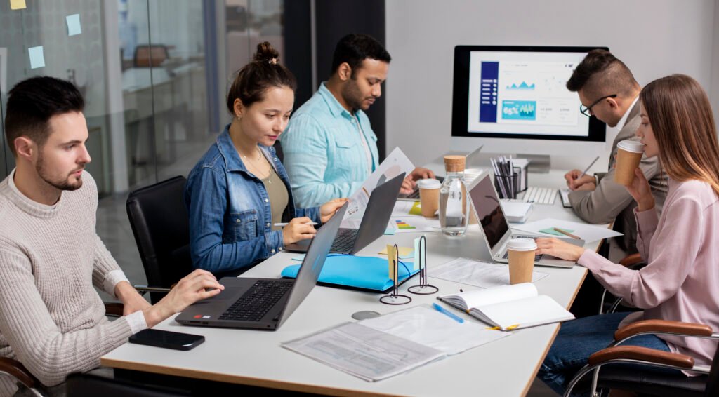 mobile Developers collaborating in office